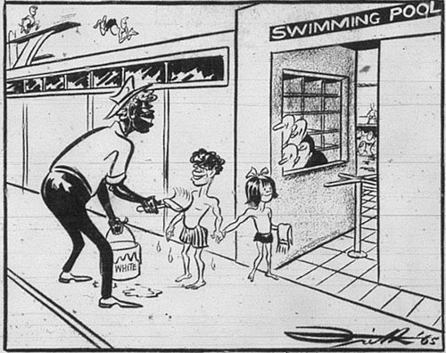 An Aboriginal parent painting their children with white paint so they can enter a swimming pool.
